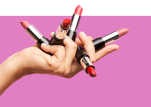 hand holding different shades of lipstick