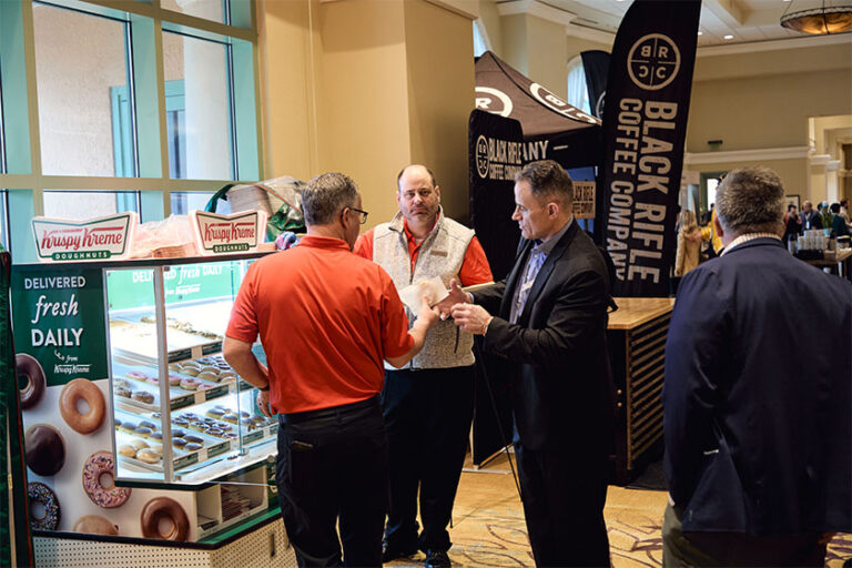 People enjoying Krispy Kreme doughnuts