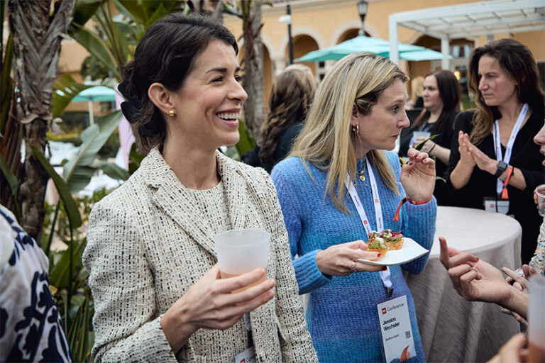 two people enjoying snacks at the 2024 ICR conference