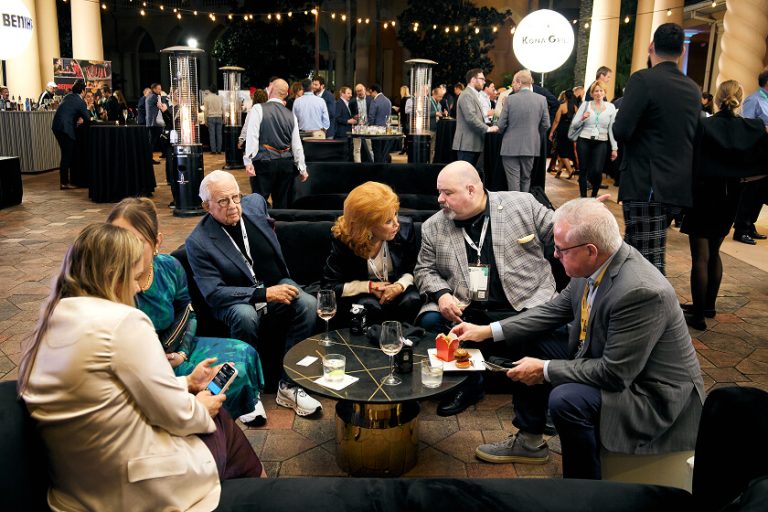 Group of attendees interacting at Welcome Reception